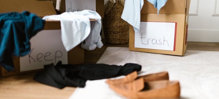 carton boxes labelled keep and trash