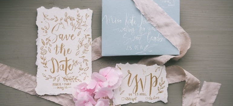 Save the date invitations on a table.