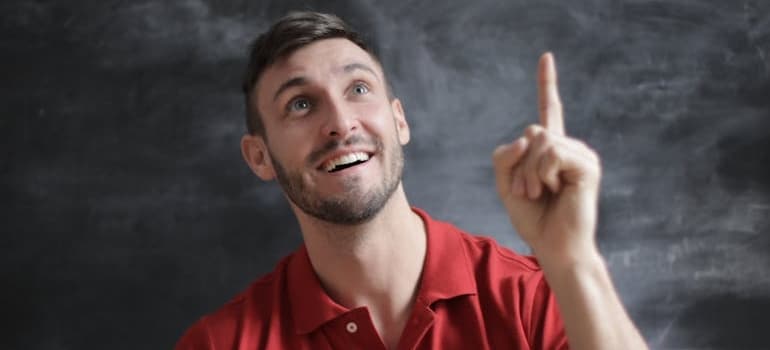 a man in a red shirt thinking about myths about portable storage units