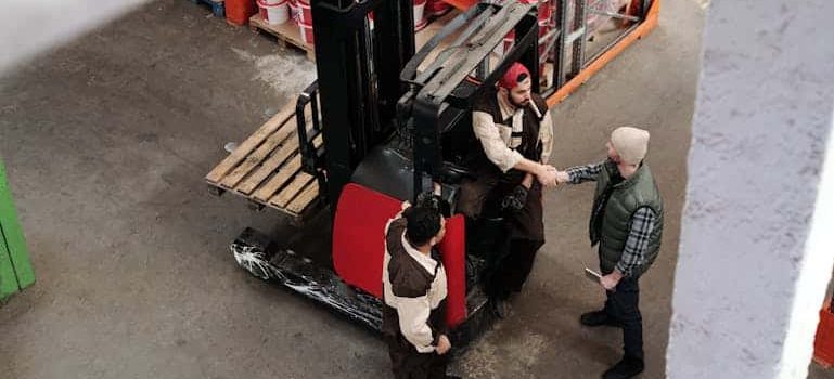 three men talking about warehousing in aspen co