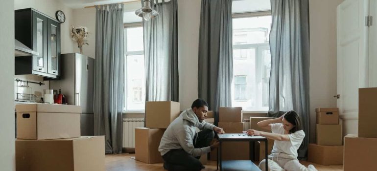 man and woman packing for a move
