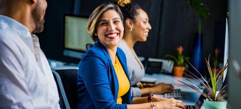 people at work talking about the things to know before moving to Colorado