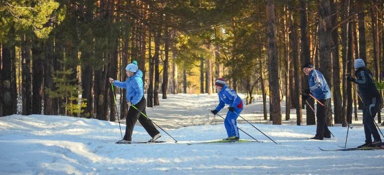 four people skiing after reading Colorado winter bucket list