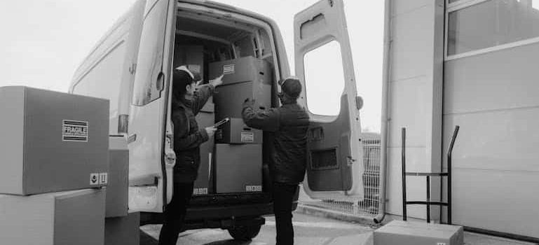 movers packing up a moving truck