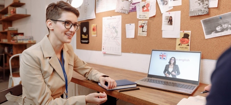 a woman sitting by the table