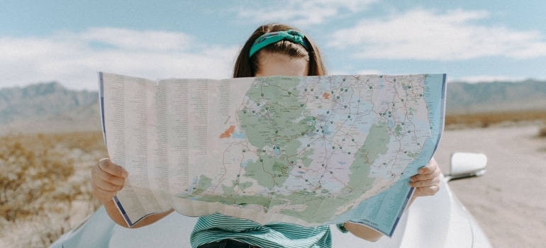 a woman looking at a map