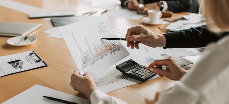 people looking at a document in order to budget for an office move