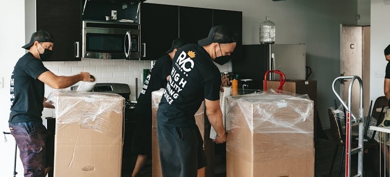 men packing appliances