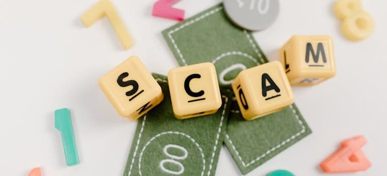scam written on cubes