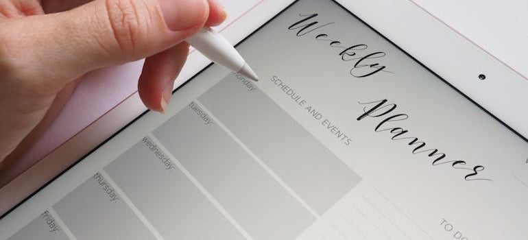a person using a digital weekly plan